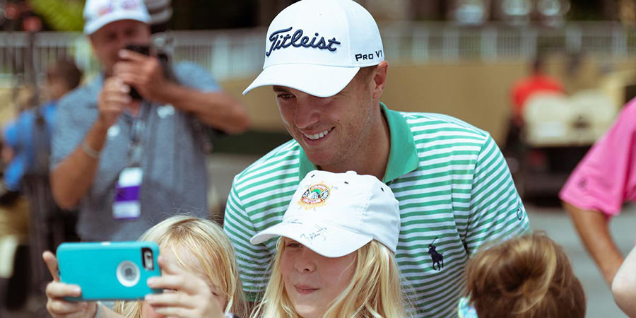 Girl tacking selfie with player